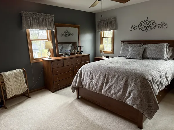 a bedroom with a bed and window