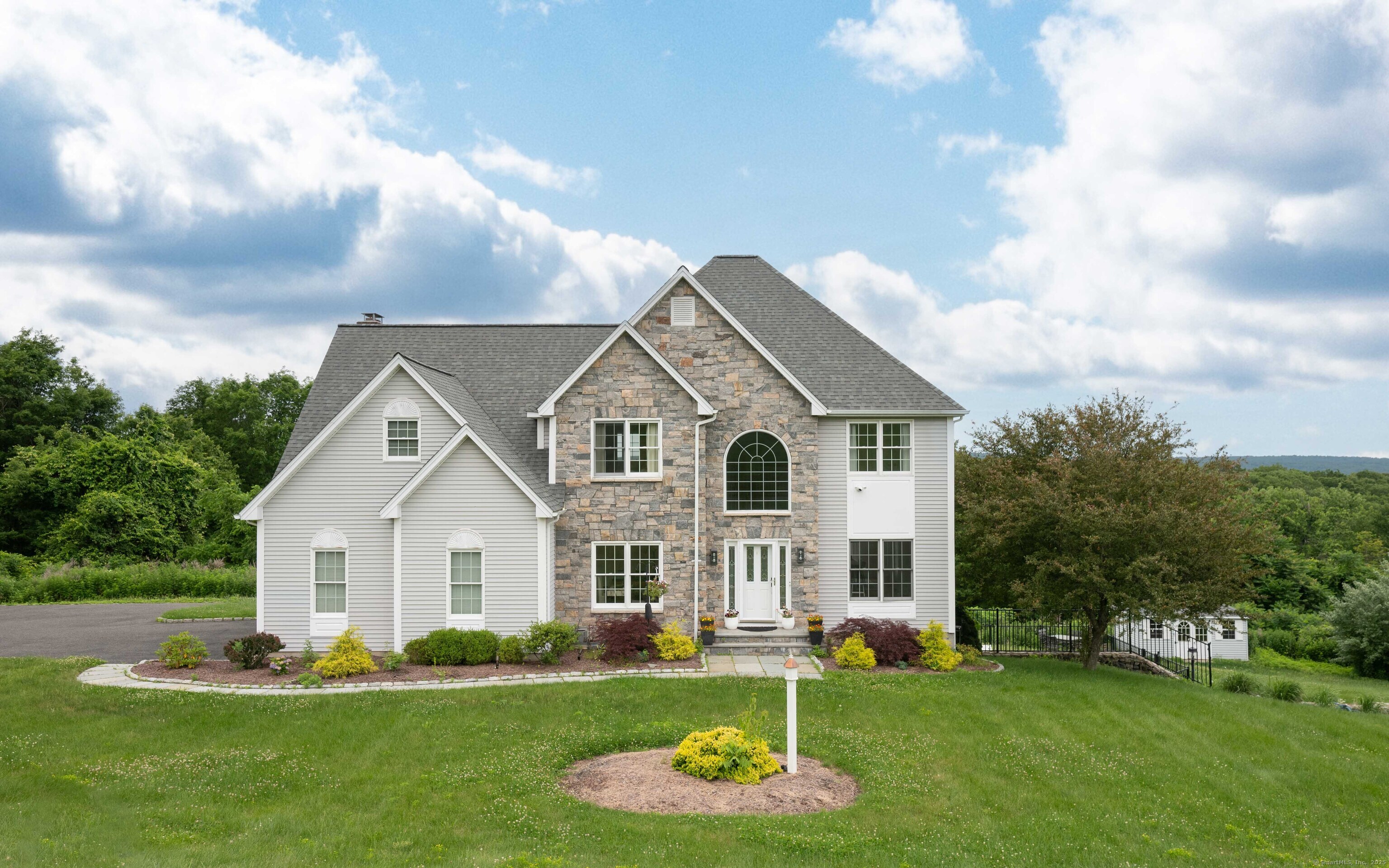 557 Upper Grassy Hill Road Woodbury, CT 06798 - Photo 1 of 40 a front view of a house with a yard