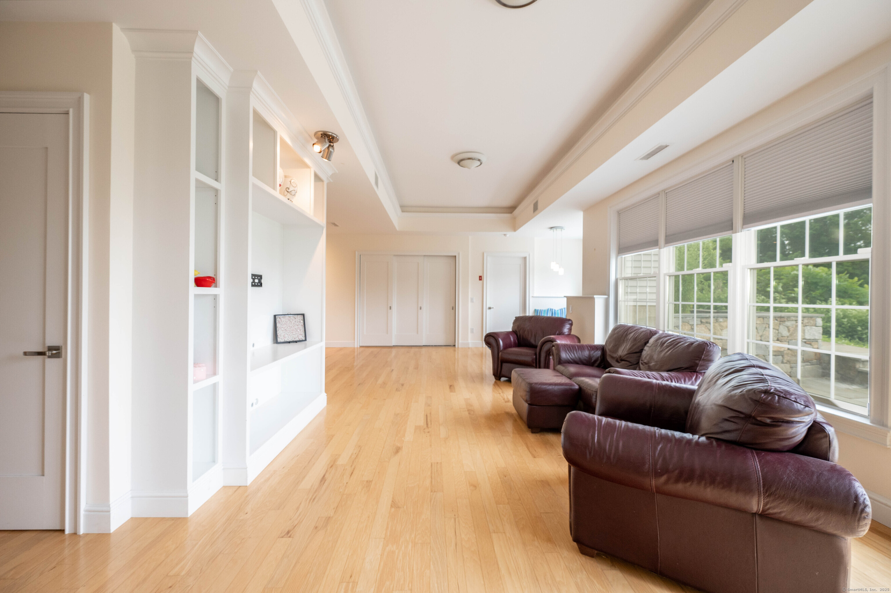 557 Upper Grassy Hill Road Woodbury, CT 06798 - Photo 28 of 40 a living room with furniture and a large window