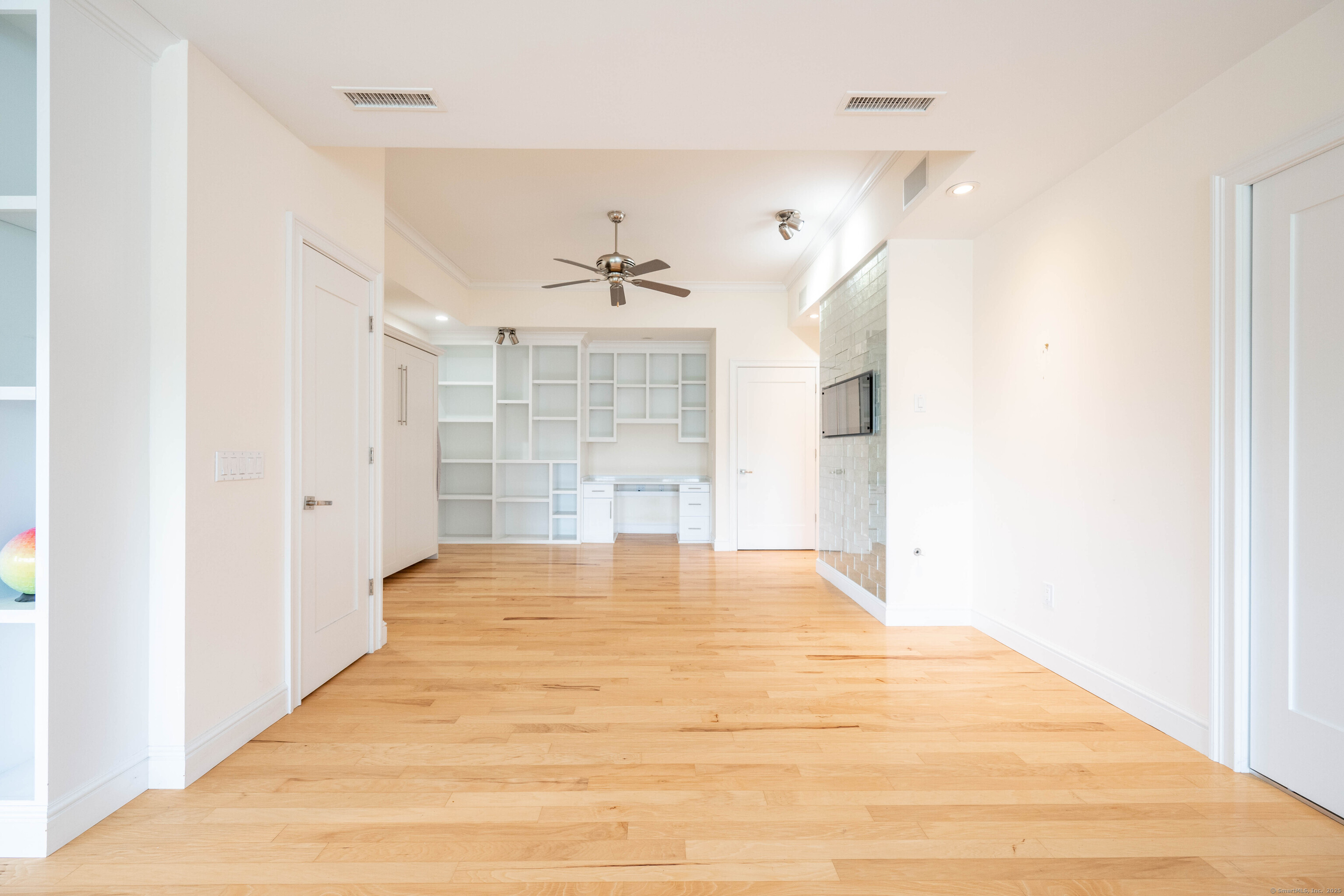 557 Upper Grassy Hill Road Woodbury, CT 06798 - Photo 29 of 40 a view of empty room with wooden floor