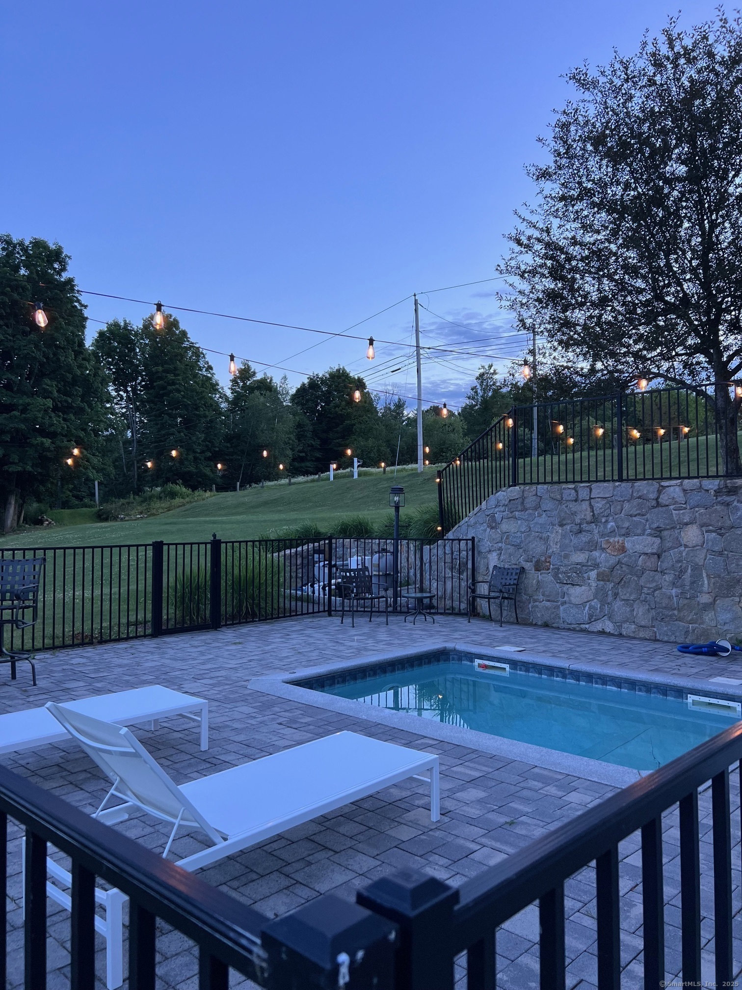 557 Upper Grassy Hill Road Woodbury, CT 06798 - Photo 35 of 40 a view of a backyard with a sitting area