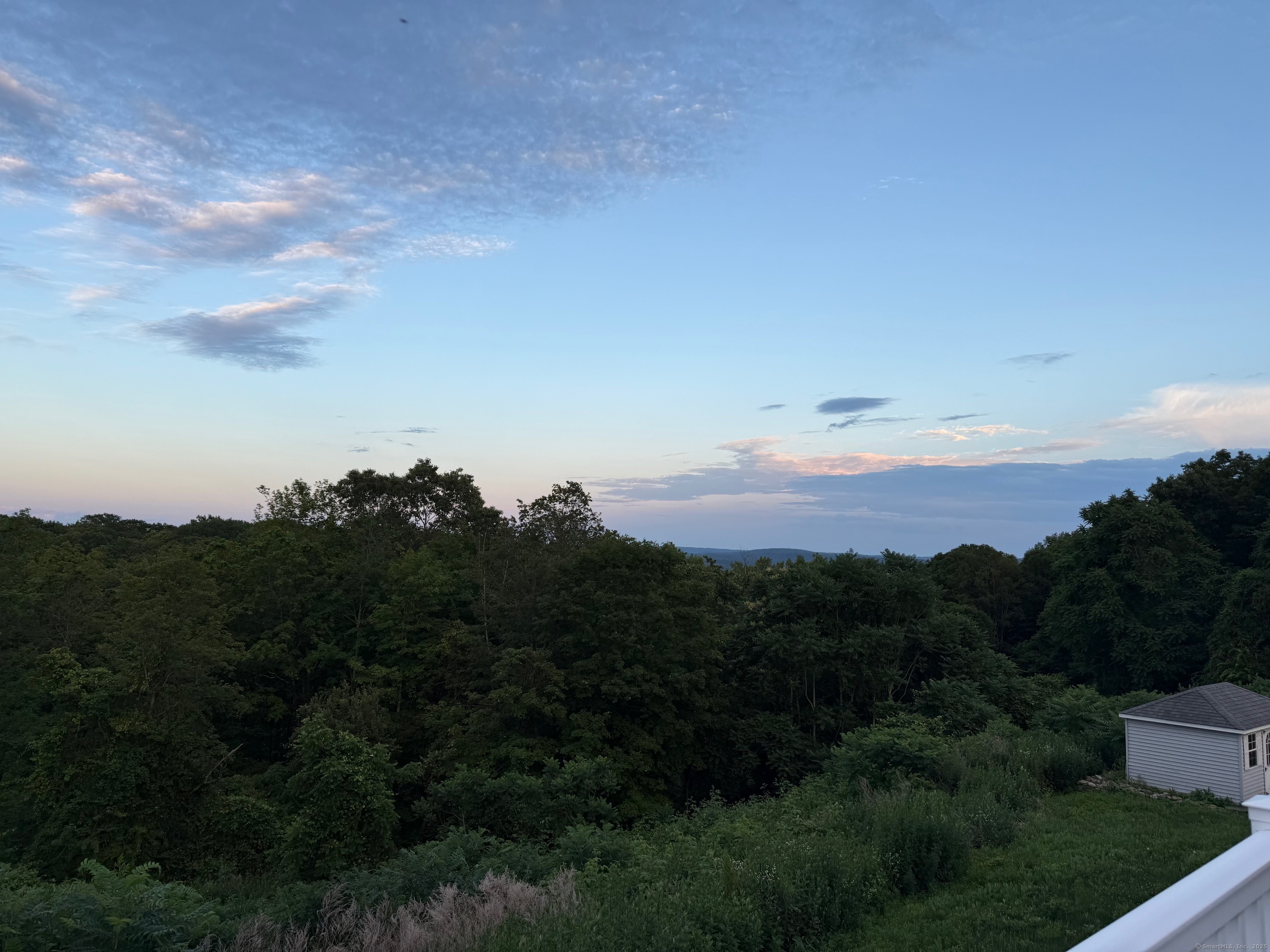 557 Upper Grassy Hill Road Woodbury, CT 06798 - Photo 36 of 40 a view of sunset and yard