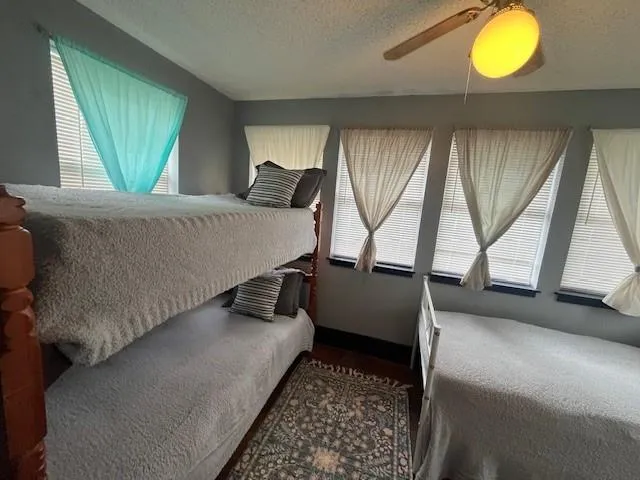 a bed room with a bed and a window