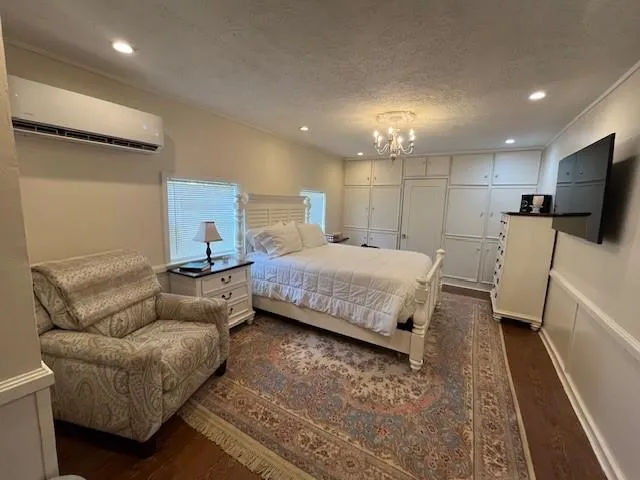 a bedroom with a bed and a couch