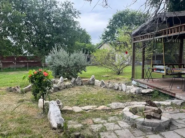 a couple of table and chairs in the garden