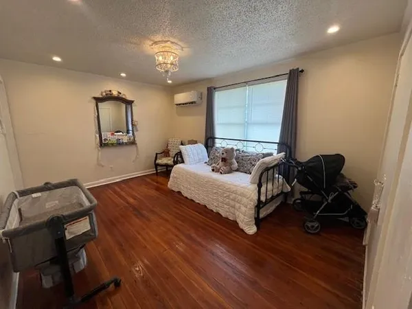 a bedroom with bed and window