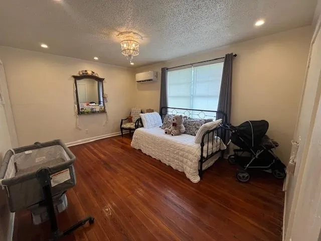 a bedroom with bed and window