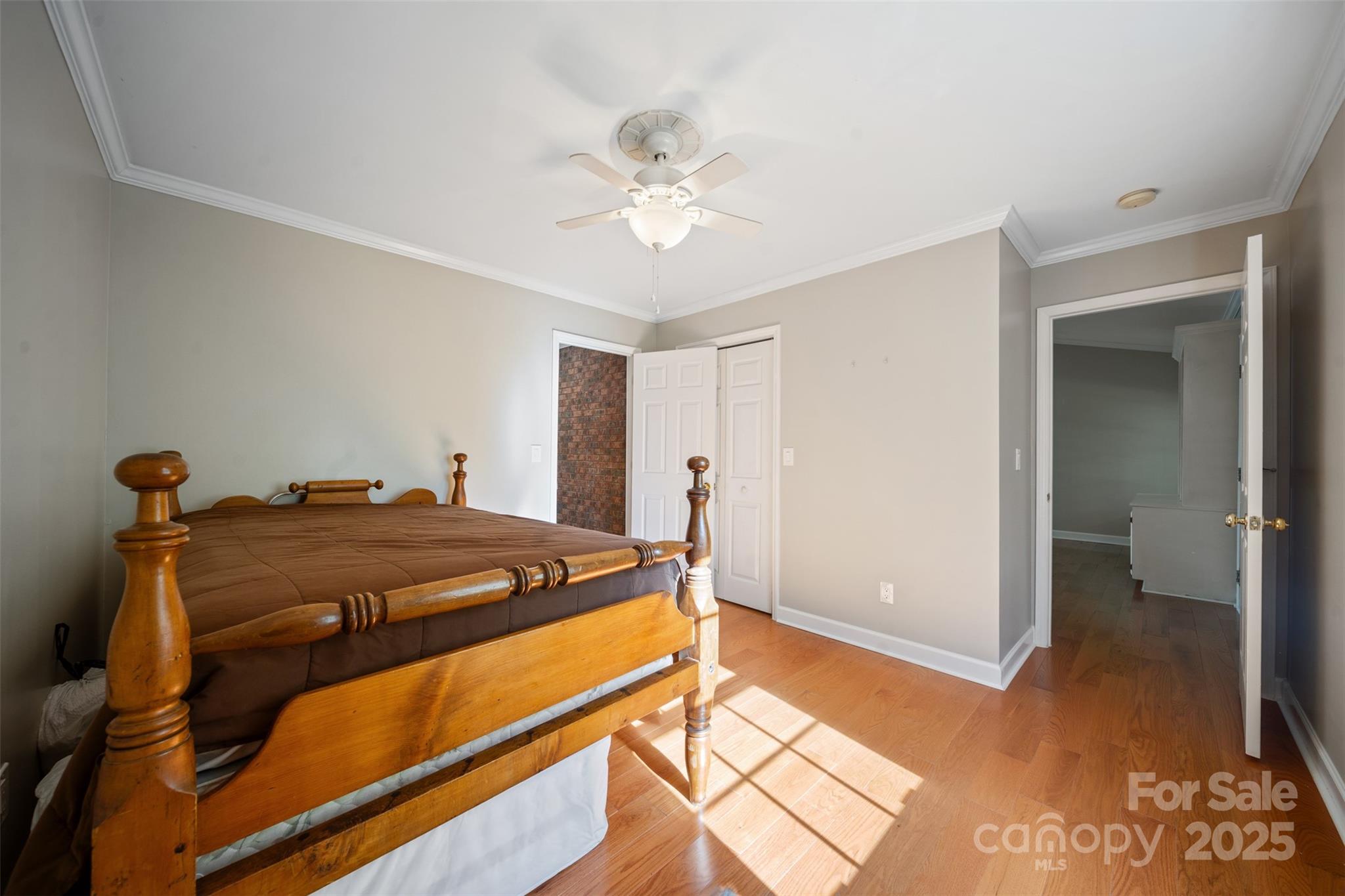 8222 Henry Harris Road Fort Mill, SC 29707 - Photo 17 of 45 a bed room with a bed and a chandelier
