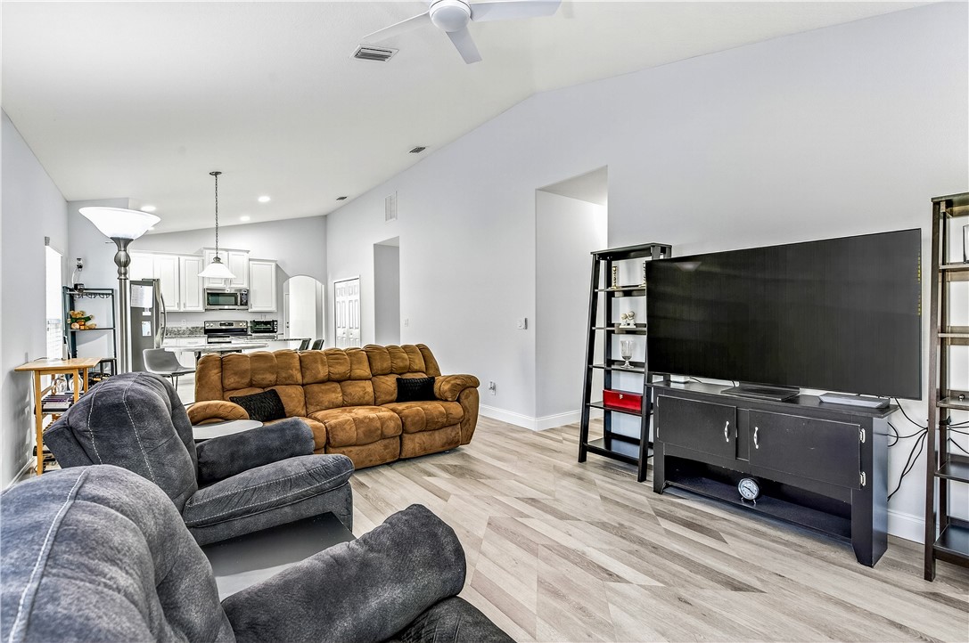 535 Valencia Circle Southwest Vero Beach, FL 32968 - Photo 13 of 36 a living room with furniture and a flat screen tv