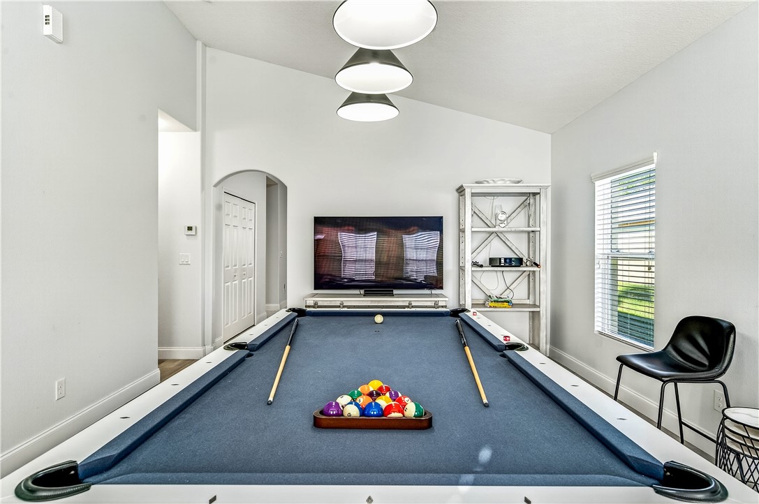 535 Valencia Circle Southwest Vero Beach, FL 32968 - Photo 15 of 36 a living room with furniture potted plant and a large window