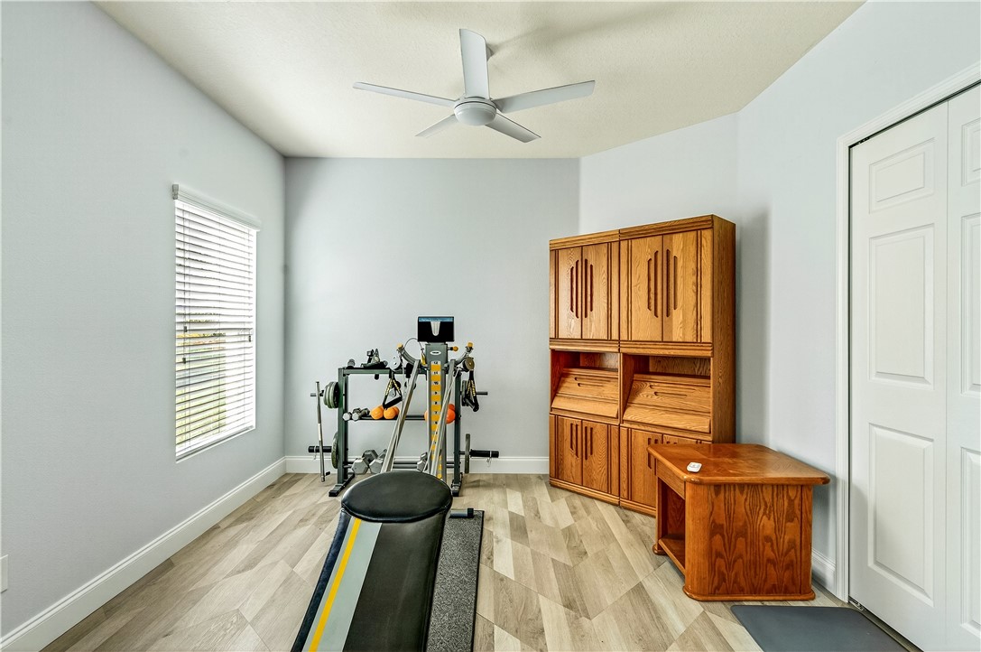 535 Valencia Circle Southwest Vero Beach, FL 32968 - Photo 19 of 36 wooden floor and windows in a room