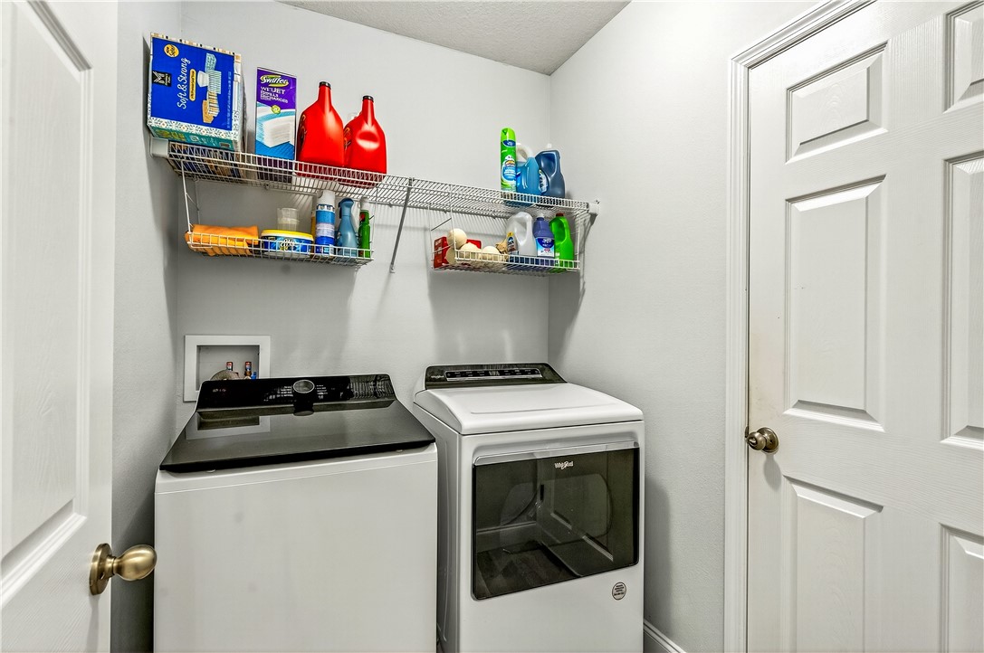 535 Valencia Circle Southwest Vero Beach, FL 32968 - Photo 25 of 36 a kitchen with stainless steel appliances granite countertop a stove and a refrigerator