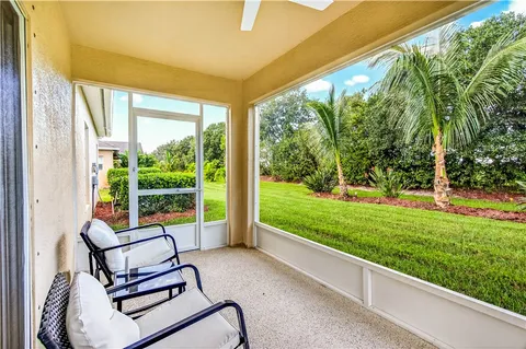 a house view with a sitting space and garden