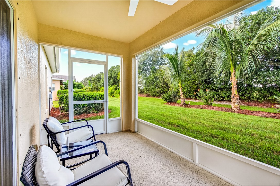 535 Valencia Circle Southwest Vero Beach, FL 32968 - Photo 27 of 36 a house view with a sitting space and garden