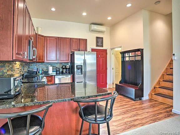 5359 State Route 231 Windham, NY 12496 - Photo 2 of 3 a kitchen with stainless steel appliances granite countertop a refrigerator and a stove top oven