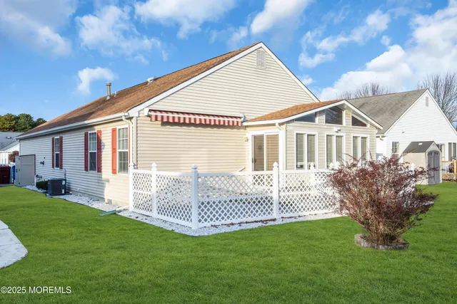 a front view of a house with a large window