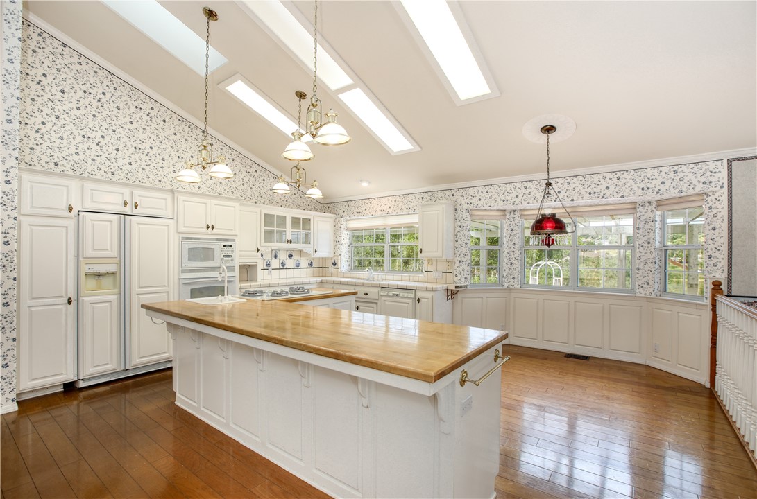 350 Corbett Canyon Road Arroyo Grande, CA 93420 - Photo 26 of 66 a view of a kitchen with kitchen island a counter top space a sink stainless steel appliances and cabinets