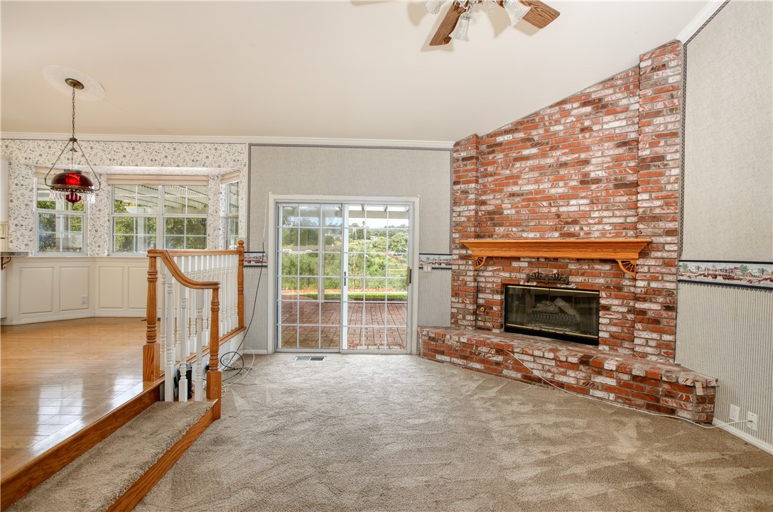 350 Corbett Canyon Road Arroyo Grande, CA 93420 - Photo 32 of 66 a living room with furniture and a fireplace