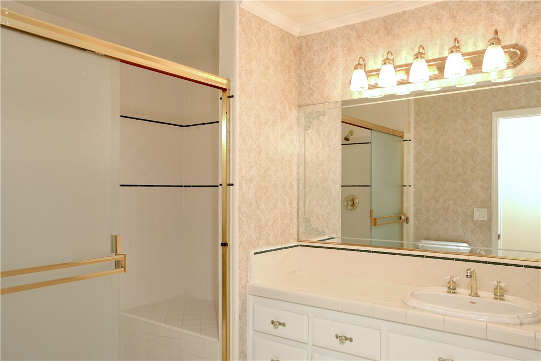 350 Corbett Canyon Road Arroyo Grande, CA 93420 - Photo 35 of 66 a bathroom with a sink and a mirror