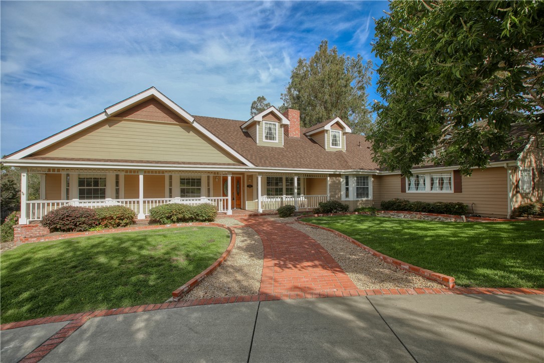 350 Corbett Canyon Road Arroyo Grande, CA 93420 - Photo 4 of 66 a front view of a house with a garden and trees