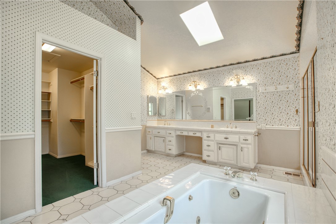 350 Corbett Canyon Road Arroyo Grande, CA 93420 - Photo 43 of 66 a bathroom with a tub sink and mirror