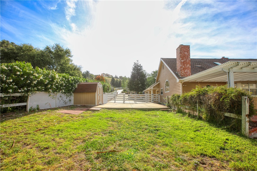 350 Corbett Canyon Road Arroyo Grande, CA 93420 - Photo 9 of 66 a view of a house with a yard and sitting area