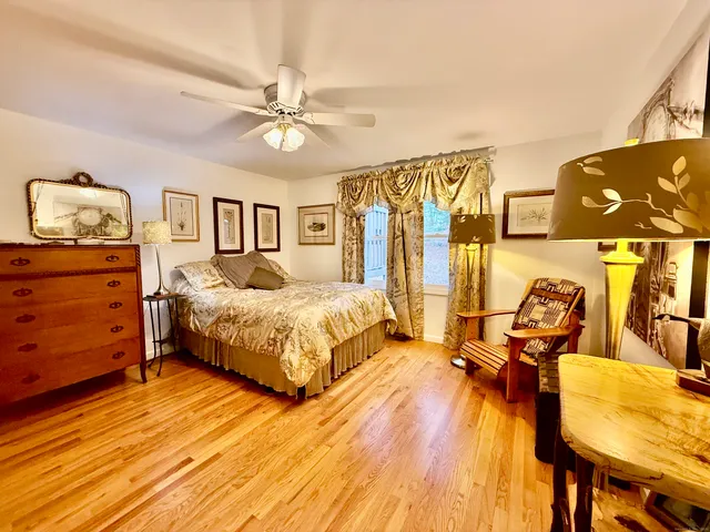 a living room with furniture and a lamp