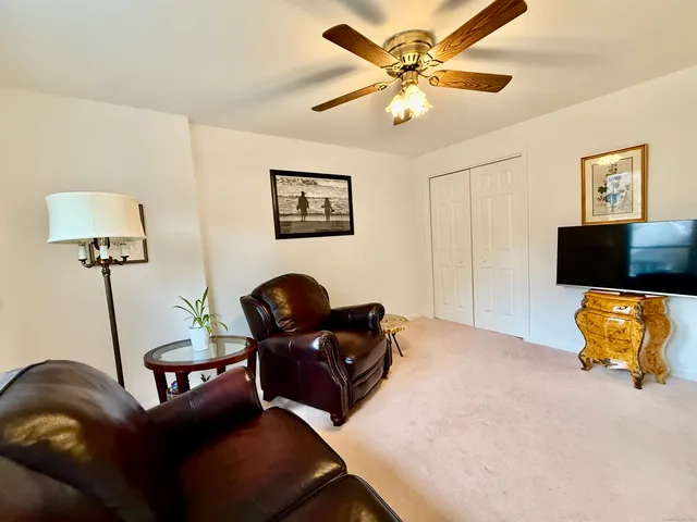 a view of a entryway with furniture and wooden floor