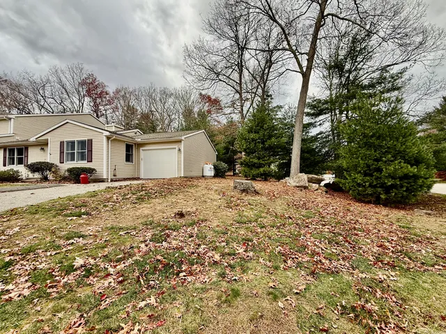 a view of a chair and table on the deck