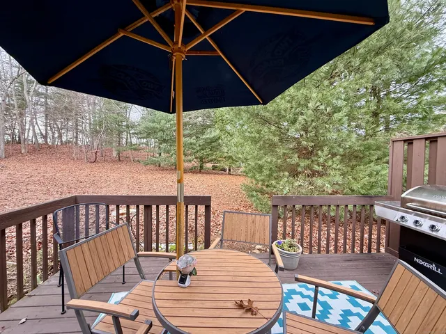 a view of balcony with outdoor seating and wooden floor