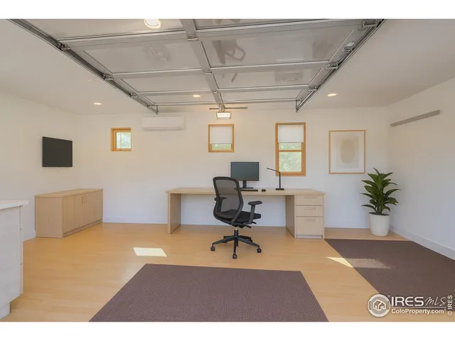 a workspace with furniture and a potted plant