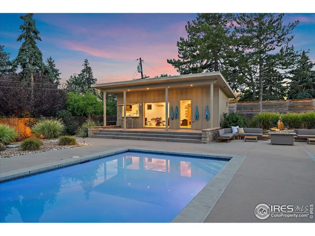 a view of a house with a swimming pool and a chairs