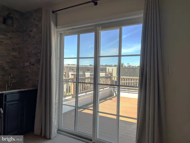 a view of an empty room and balcony