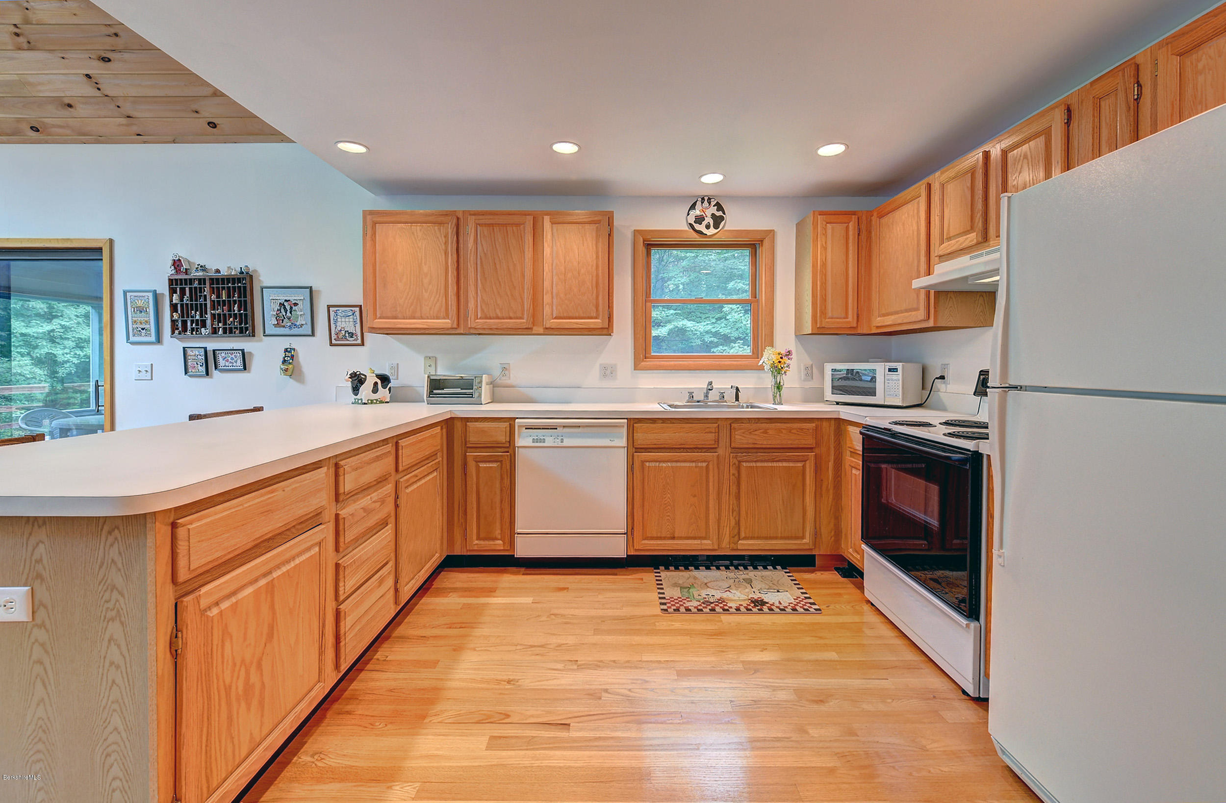 80 Harrington Road Otis, MA 01253 - Photo 14 of 34 a kitchen with a sink window and cabinets