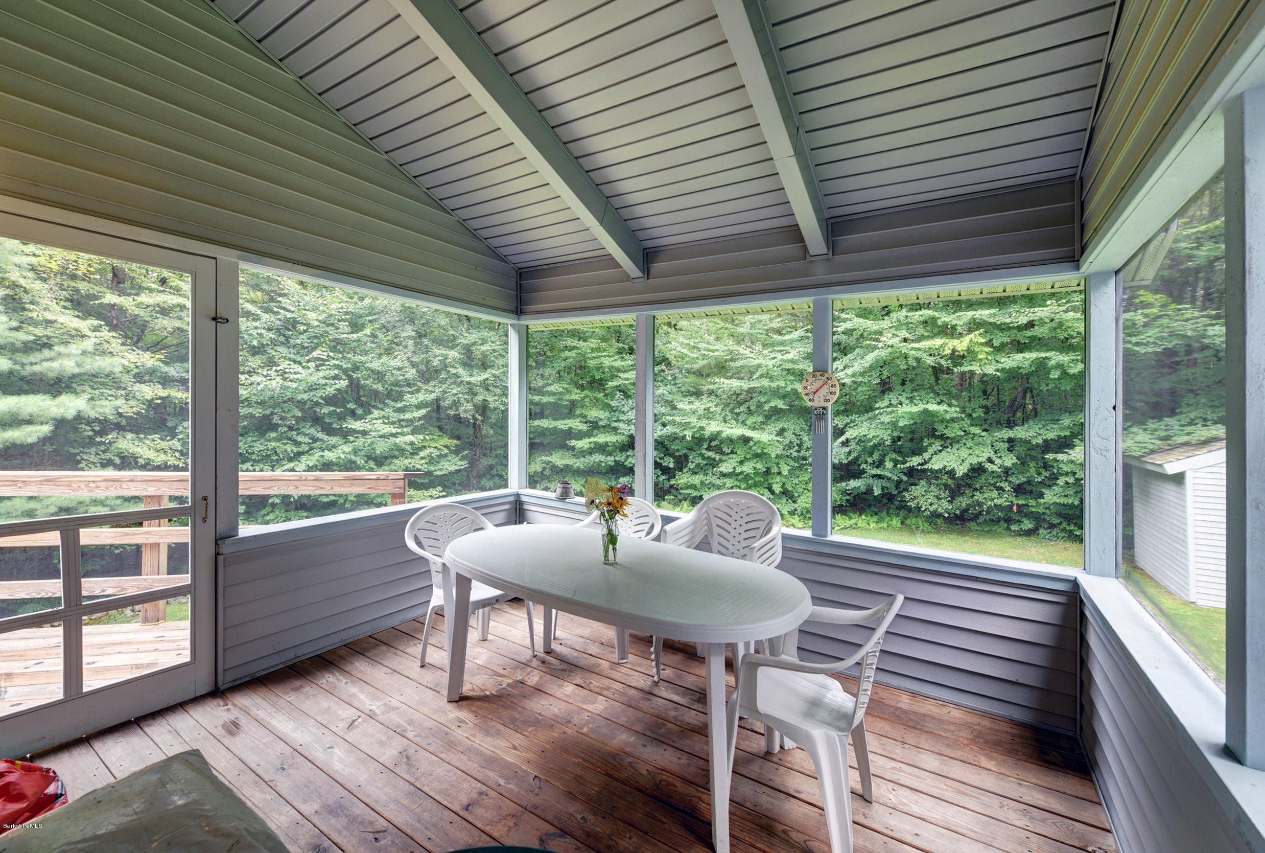 80 Harrington Road Otis, MA 01253 - Photo 22 of 34 a dining room with wooden floor table and chairs