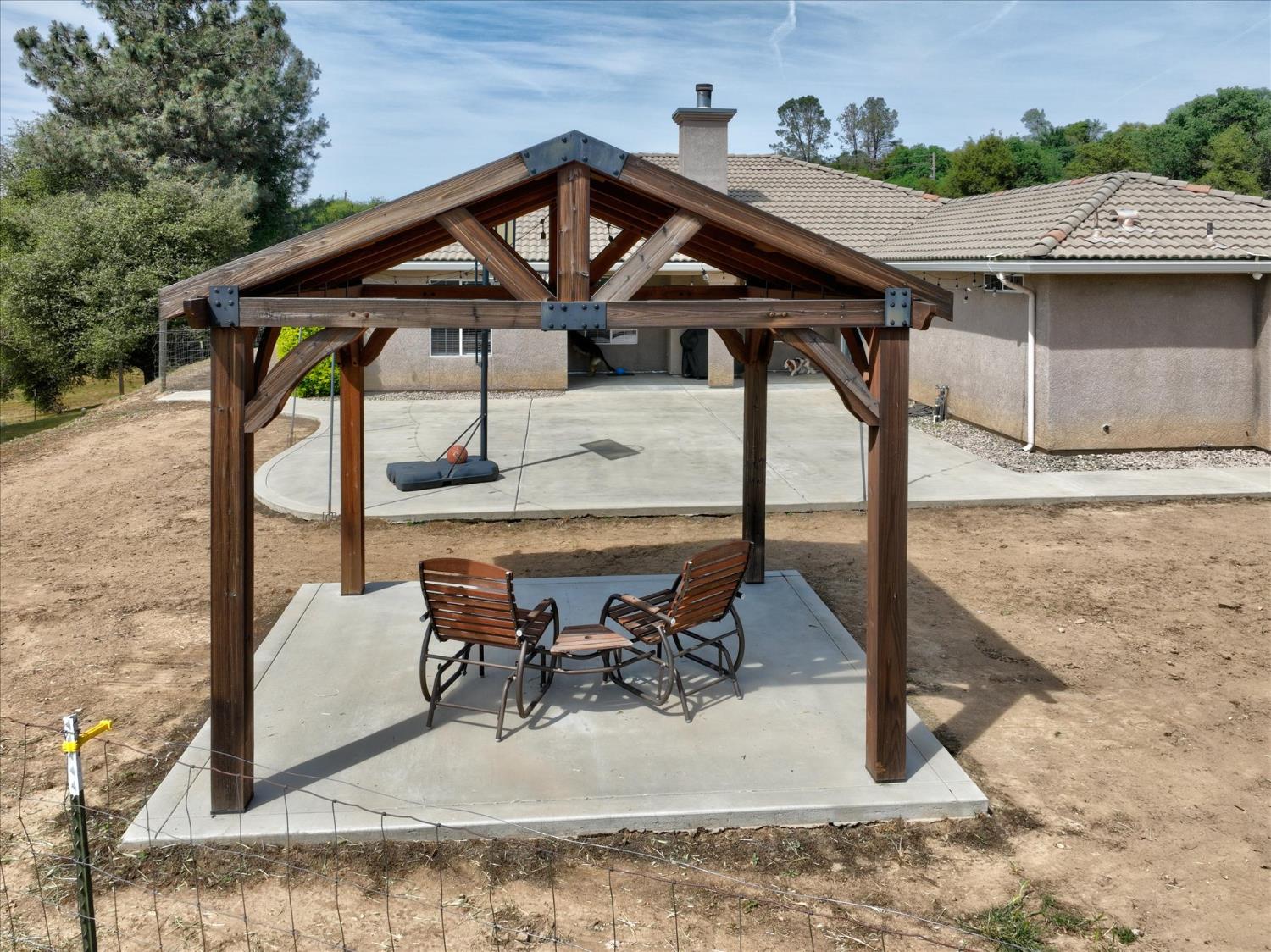 47482 Veater Ranch Road Coarsegold, CA 93614 - Photo 45 of 51 a view of a roof deck with table and chairs