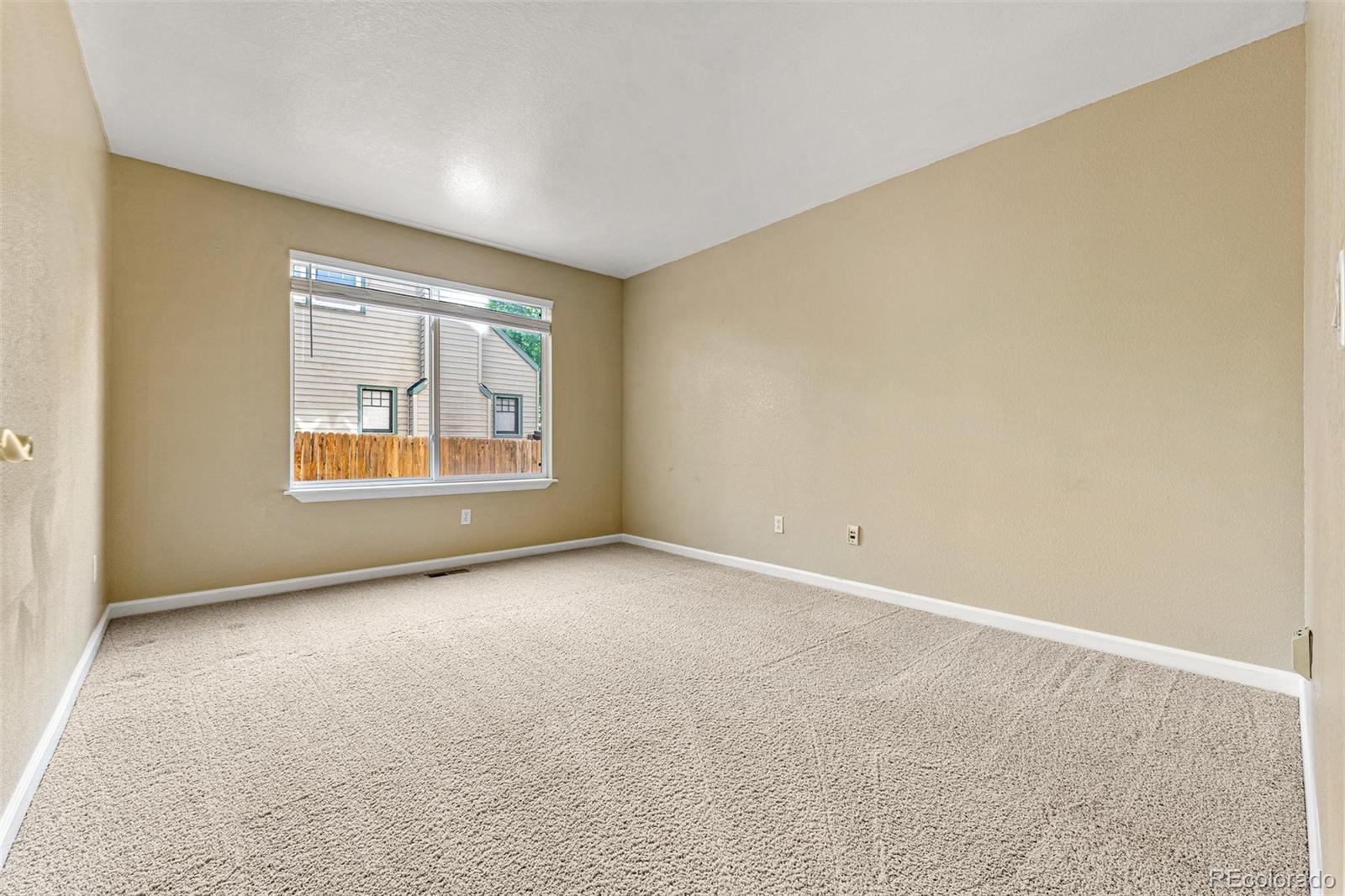 276 East Fair Lane Centennial, CO 80121 - Photo 17 of 38 an empty room with windows