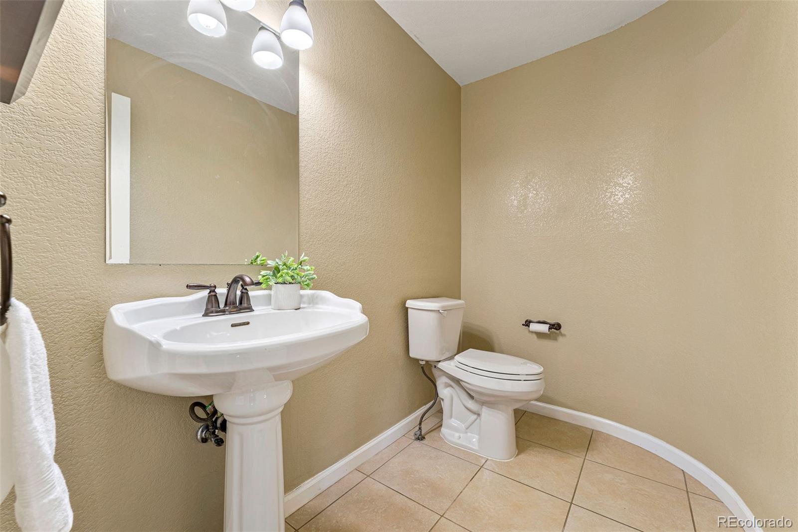 276 East Fair Lane Centennial, CO 80121 - Photo 18 of 38 a white sink sitting next to a white toilet