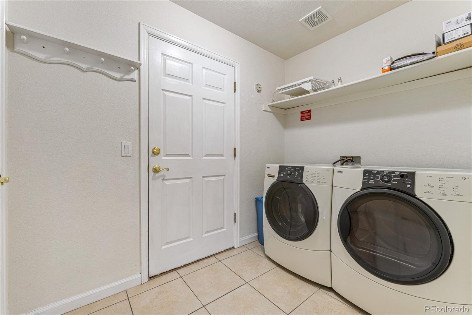 276 East Fair Lane Centennial, CO 80121 - Photo 19 of 38 a utility room with dryer and washer