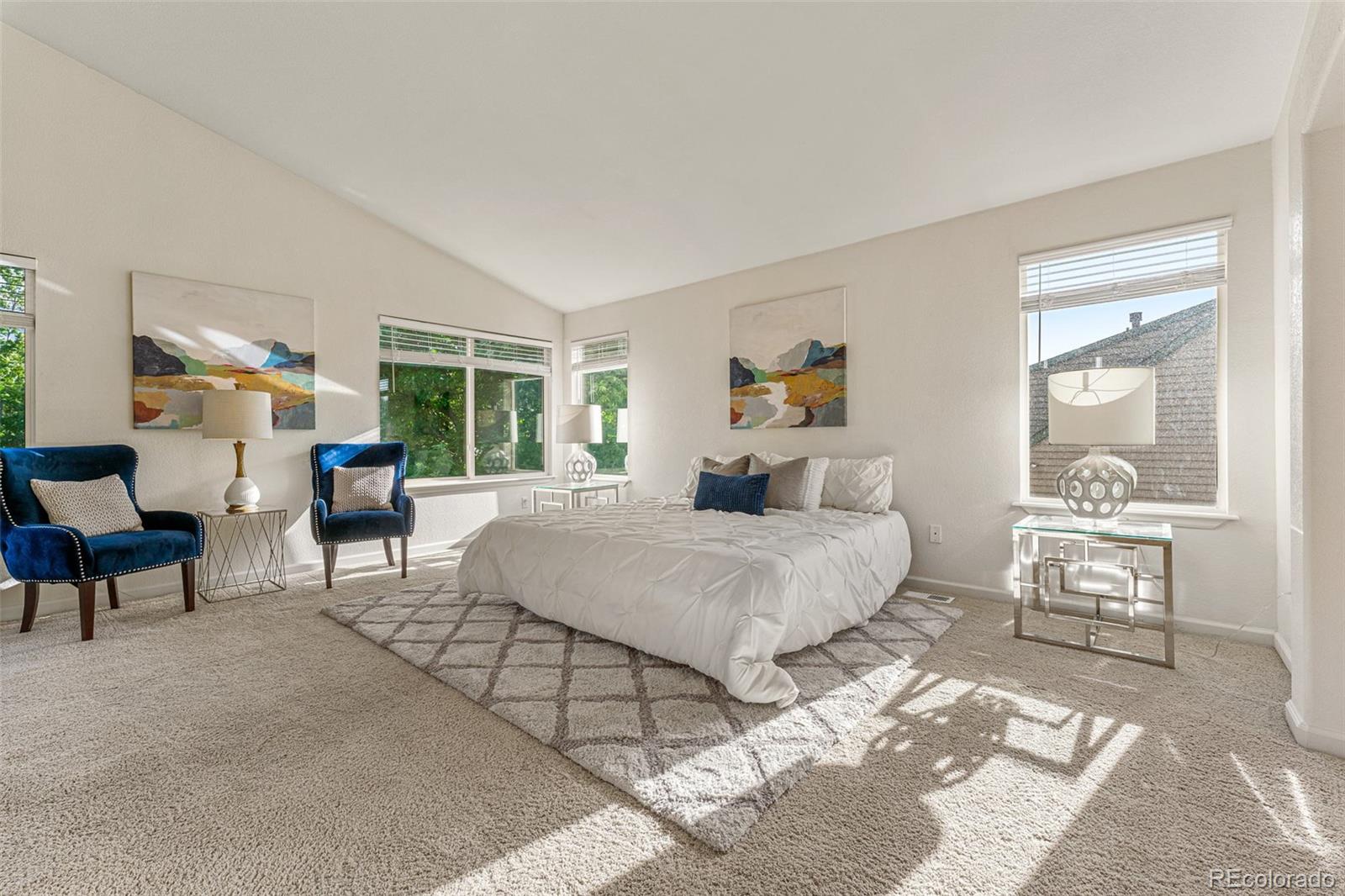 276 East Fair Lane Centennial, CO 80121 - Photo 20 of 38 a bedroom with a bed a table and chair