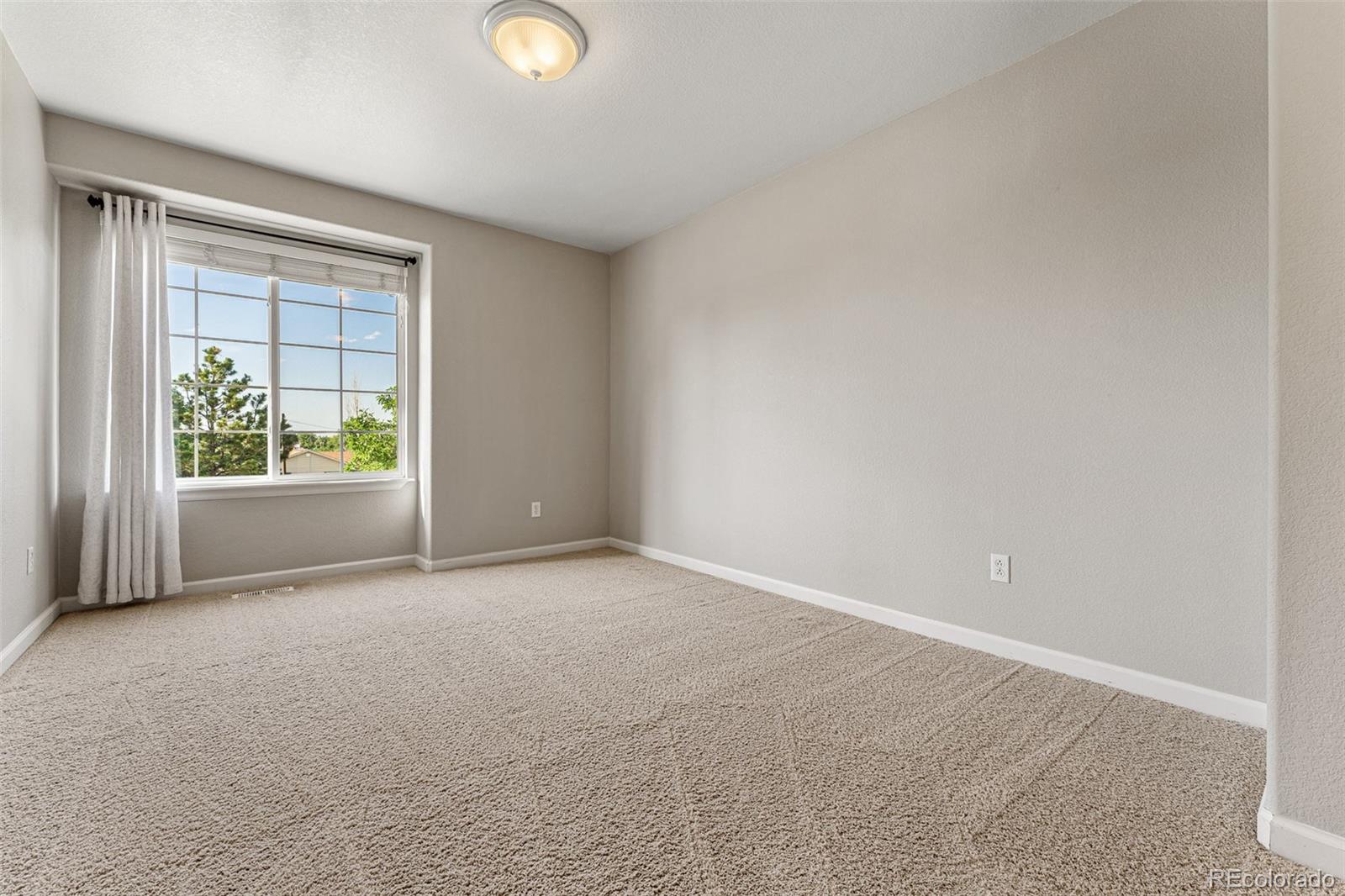 276 East Fair Lane Centennial, CO 80121 - Photo 26 of 38 an empty room with windows