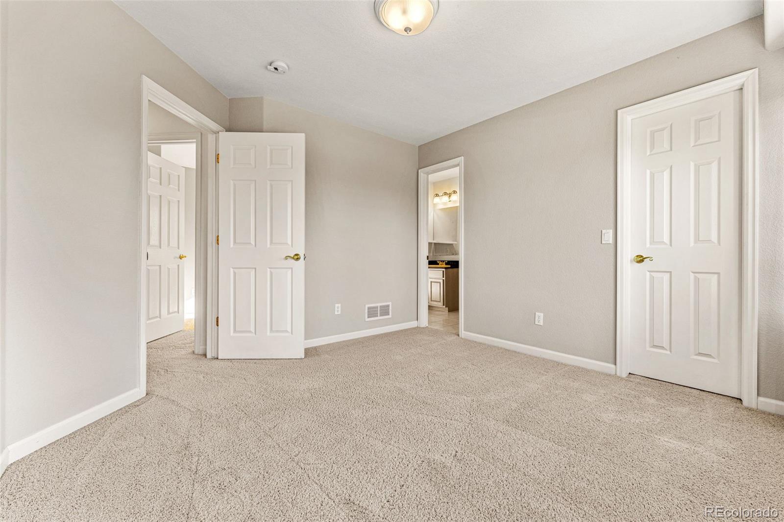 276 East Fair Lane Centennial, CO 80121 - Photo 30 of 38 an empty room with windows and closet