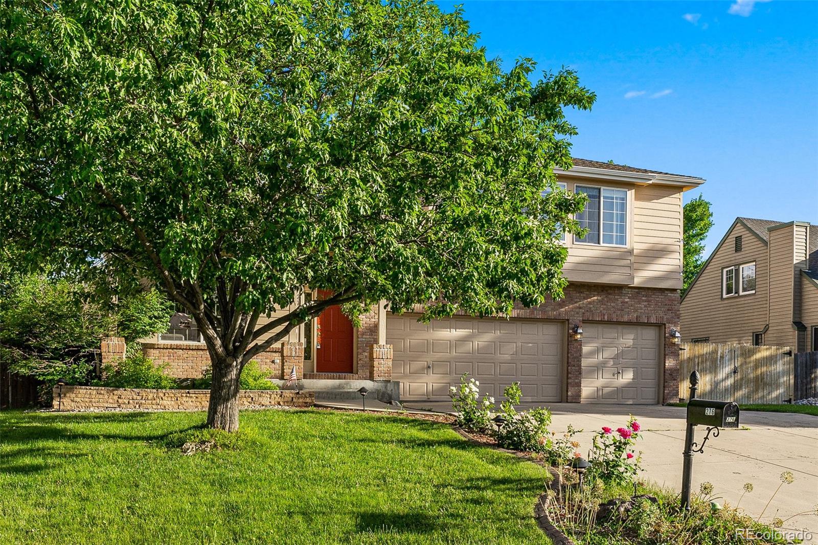 276 East Fair Lane Centennial, CO 80121 - Photo 3 of 38 front view of house with a yard