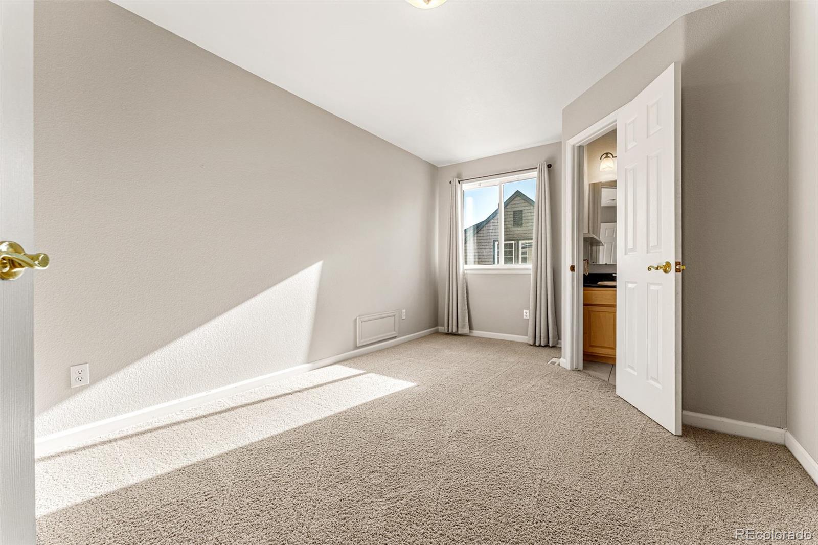 276 East Fair Lane Centennial, CO 80121 - Photo 32 of 38 an empty room with windows