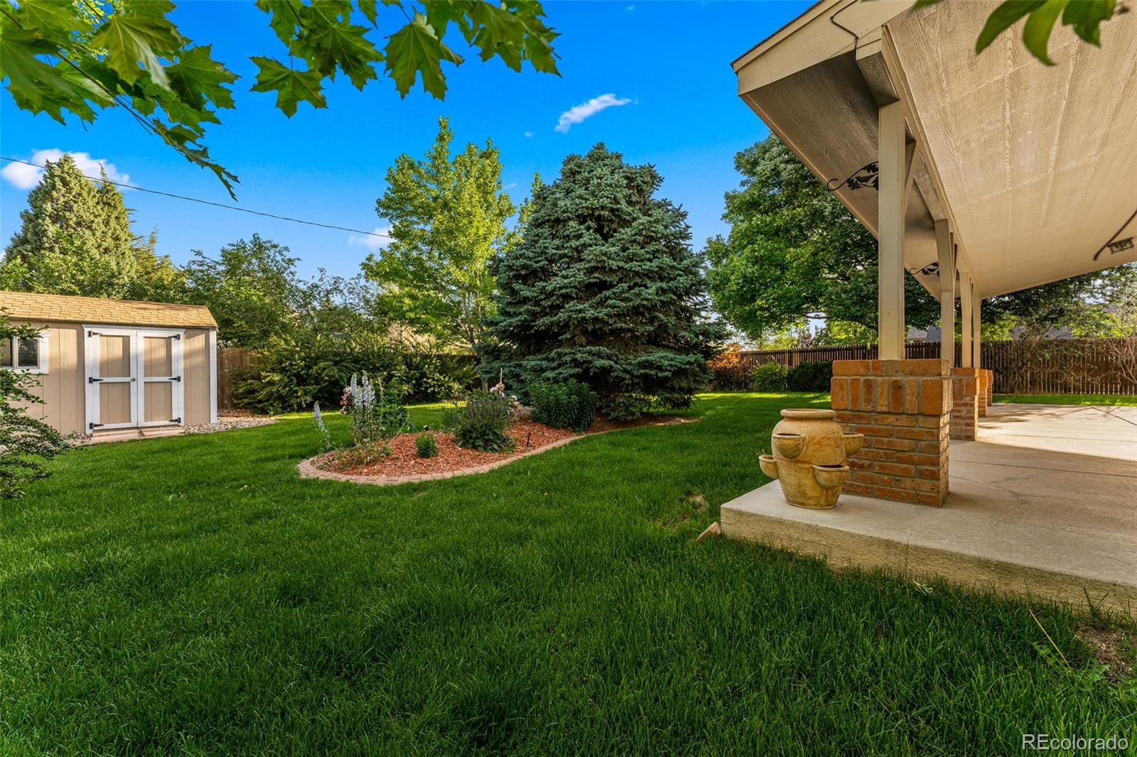 276 East Fair Lane Centennial, CO 80121 - Photo 38 of 38 a view of a garden with a fountain