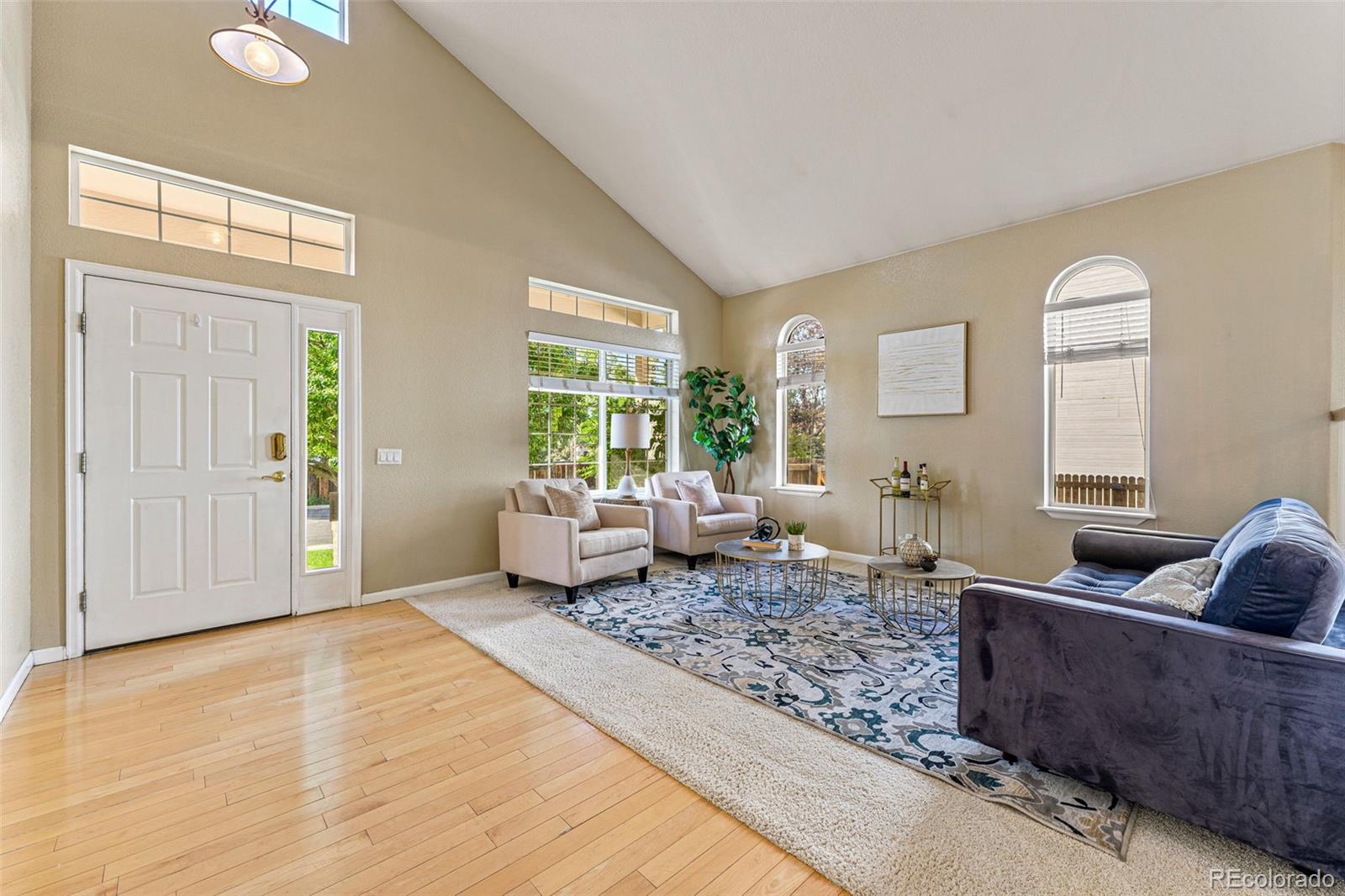 276 East Fair Lane Centennial, CO 80121 - Photo 5 of 38 a living room with furniture and a window