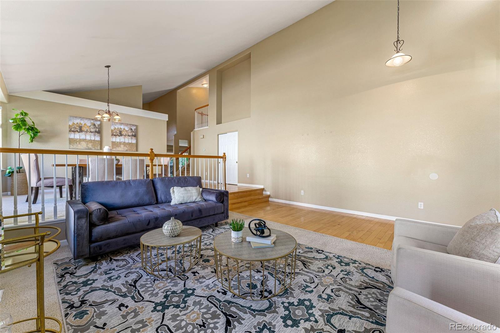 276 East Fair Lane Centennial, CO 80121 - Photo 6 of 38 a living room with furniture and wooden floor
