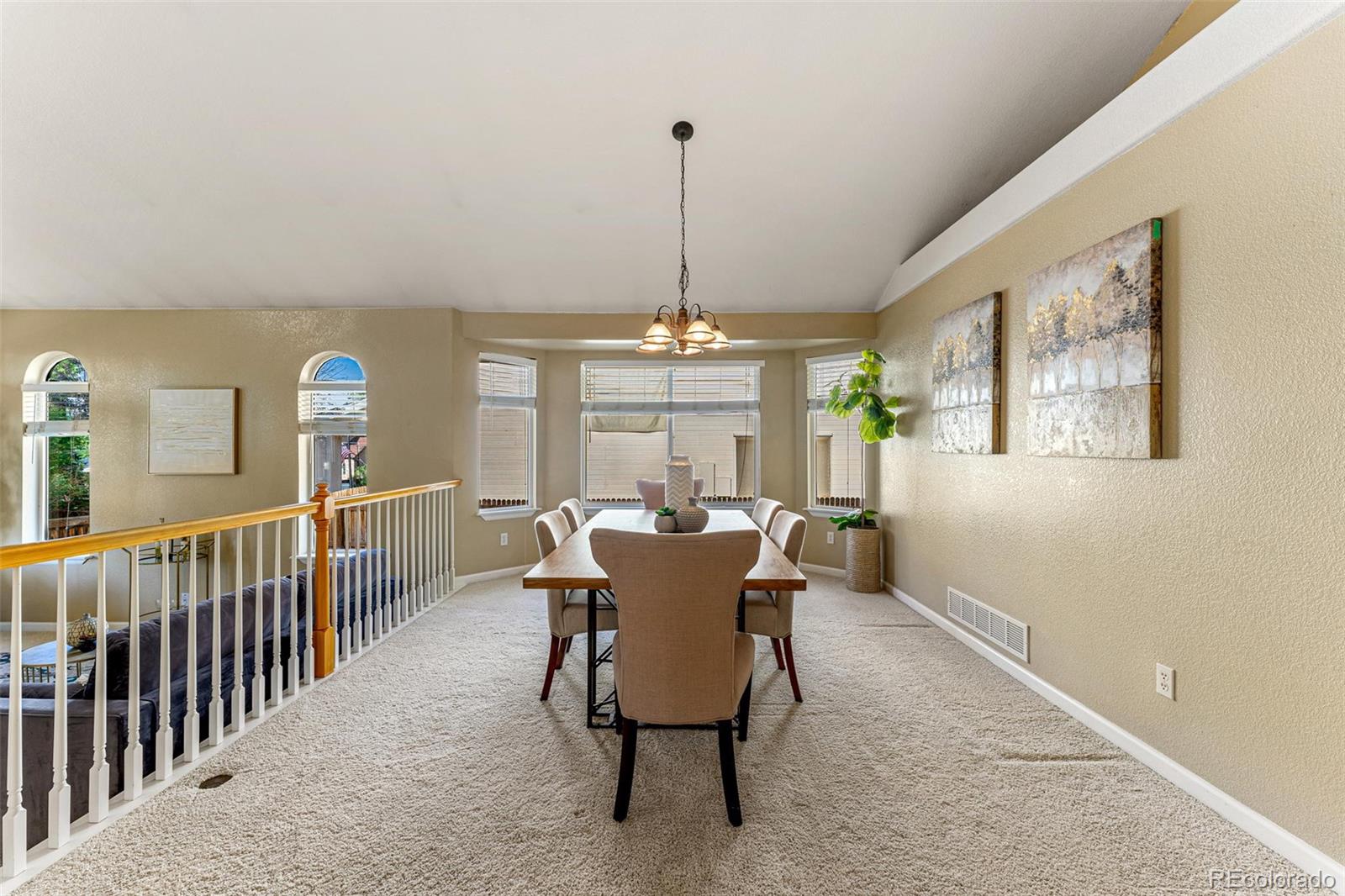 276 East Fair Lane Centennial, CO 80121 - Photo 7 of 38 a dining room with furniture a chandelier and window