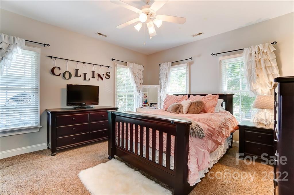 1128 Market Street Fort Mill, SC 29708 - Photo 38 of 46 a bed room with a bed and a television