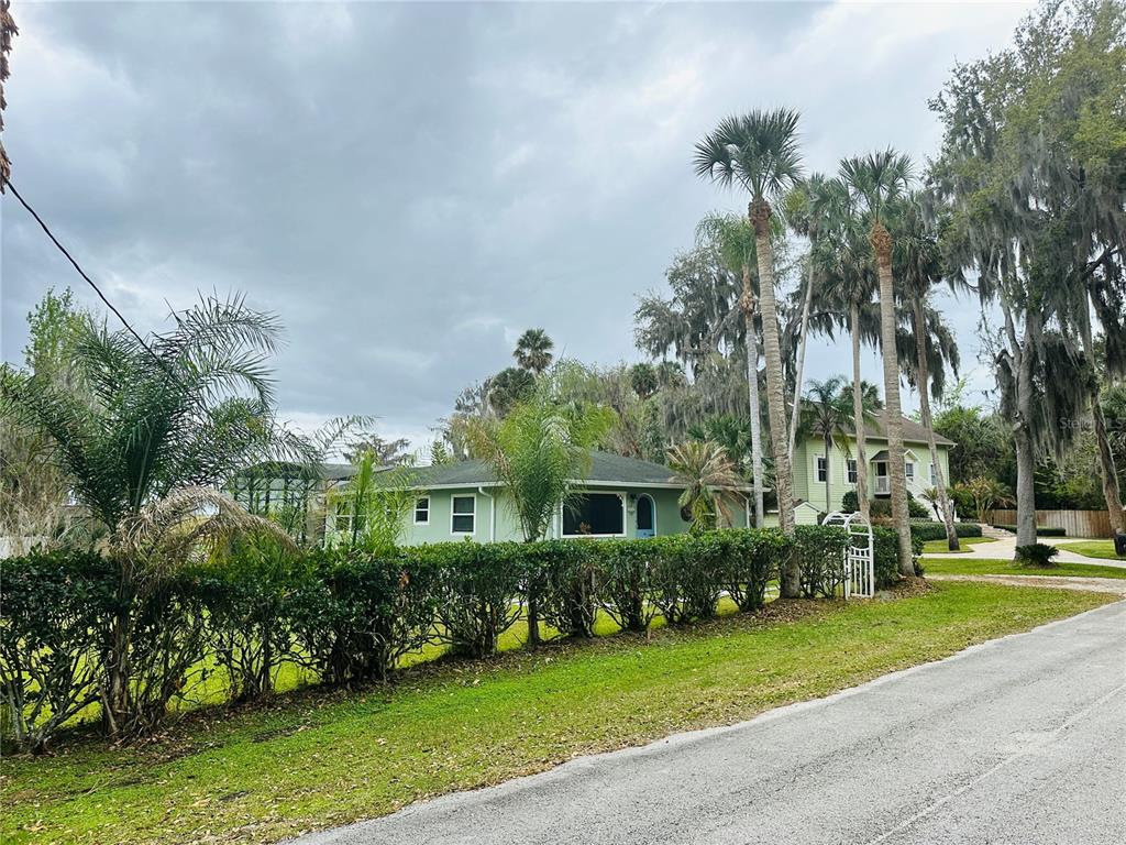 357 Magnolia Place DeBary, FL 32713 - Photo 3 of 50 a front view of a house with a yard